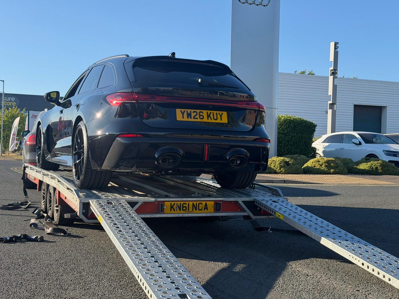 Audi performance vehicle loaded onto transporter